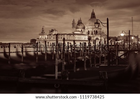 Venice church  Church Santa Maria della Salute and gondola park at water front. Italy.