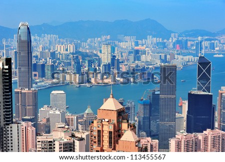 Hong Kong aerial view panorama with urban skyscrapers and sea.
