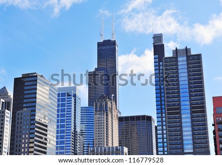 Chicago city downtown urban skyline with skyscrapers and cloudy blue sky.