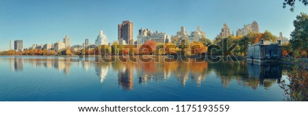 Central park Manhattan east side luxury building panorama over lake in Autumn in New York City.