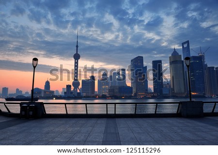 Shanghai morning before sunrise with city skyline and colorful sky over Huangpu River