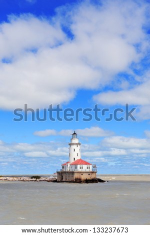 Light House of Chicago in Lake Michigan with cloud and blue sky.