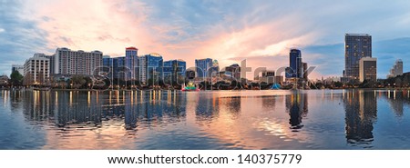 Orlando Downtown Lake Eola Panorama With Urban Buildings And Reflection