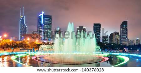 Shanghai People\'s Square with fountain and urban skyline at night panorama
