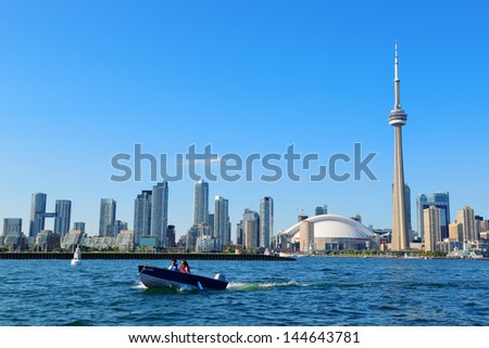 TORONTO, CANADA - JULY 3: Toronto skyline with boat on July 3, 2012 in Toronto, Canada. Toronto with the population of 6M is the provincial capital of Ontario and the largest city in Canada.