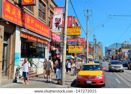 TORONTO, CANADA - JULY 2: Chinatown street view on July 2, 2012 in Toronto. It is one of the largest Chinatowns in North America and Chinese-Canadian Communities in Great Toronto Area.