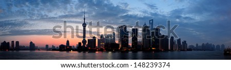 Shanghai morning silhouette before sunrise with city skyline and colorful sky over Huangpu River