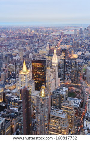 New York City Manhattan downtown aerial view at dusk with urban city skyline and skyscrapers buildings
