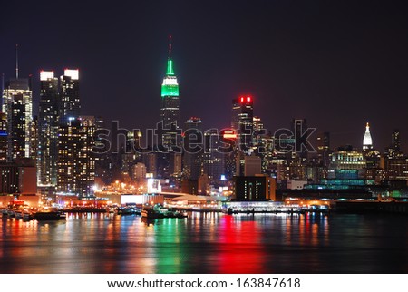 Manhattan, New York City Skyline With Empire State Building Over Hudson River At Night.