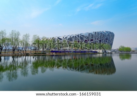 BEIJING, CHINA - APR 7: Beijing National Stadium with blue sky on April 7, 2013 in Beijing, China. The stadium was established for the 2008 Summer Olympics and Paralympics.