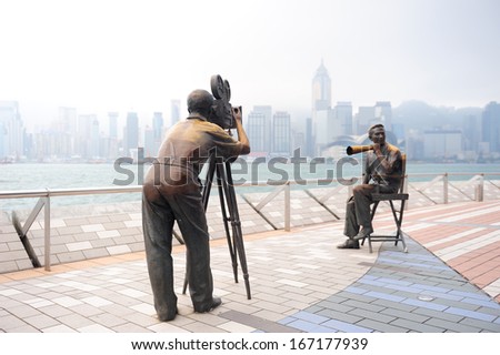 Hong Kong, China - Apr 17: Statue And Skyline In Avenue Of Stars On April 17, 2012 In Hong Kong, China. The Promenade Honours Celebrities Of The Hong Kong Film Industry As The Famous City Attraction.