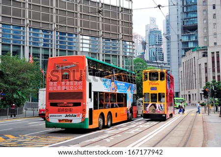Hong Kong, China - Apr 23: Double-Deck Bus With Skyscrapers On April 23, 2012 In Hong Kong, China. The Double-Deck Trams System In Hong Kong Is One Of Three And The Most Famous In The World.