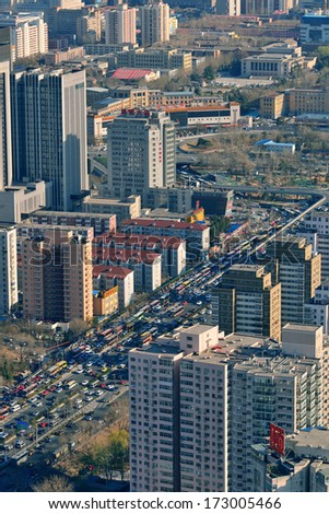 BEIJING, CHINA - APR 1: City aerial view with architecture on April 1, 2013 in Beijing, China. It is the second largest Chinese city and the nation\'s political, cultural, educational center.