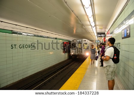 TORONTO, CANADA - JULY 3: Subway with passengers on July 3 in Toronto, Canada. 2012. Operated by Government of Ontario in Great Toronto, it carries over 217,000 passengers weekday and 57 M annually.