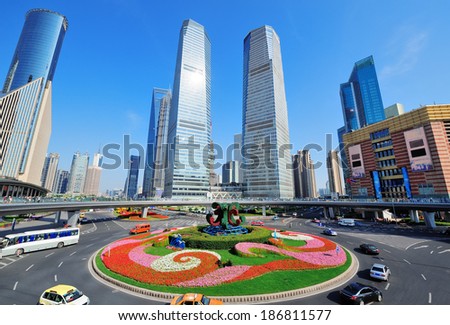 Shanghai street view with skyscrapers, roundabout and blue sky.