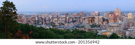 Montreal city skyline panorama at sunset viewed from Mont Royal with urban skyscrapers.