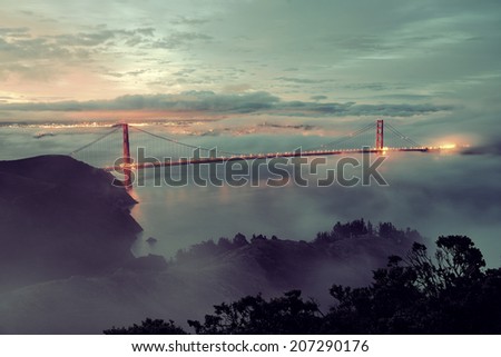Golden Gate Bridge and fog in San Francisco in early morning