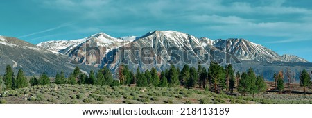 Grassland and snow mountain panorama with cloud in Yosemite.