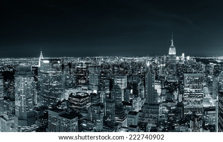 New York City Manhattan skyline at night panorama black and white with urban skyscrapers.