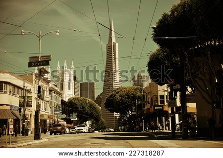 San Francisco, CA - MAY 11: Downtown Street view with the Pyramid on May 11, 2014 in San Francisco. It is the most densely settled large city in California and the second-most in US.