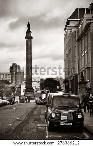 EDINBURGH, UK - OCT 8: City street view with traffic on October 8, 2013 in Edinburgh. As the capital city of Scotland, it is the largest financial centre after London in the UK.