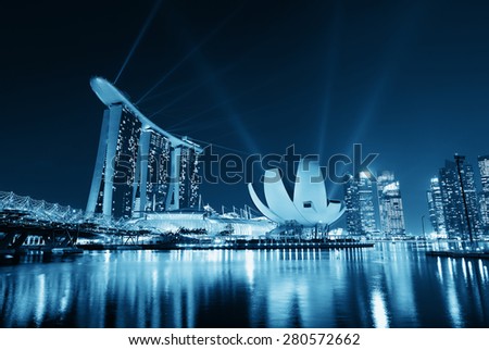 SINGAPORE - APR 5: Marina Bay Sands hotel light show at night on April 5, 2014 in Singapore. It is the world's most expensive building with cost of US$ 4.7 billion and landmark of Singapore.