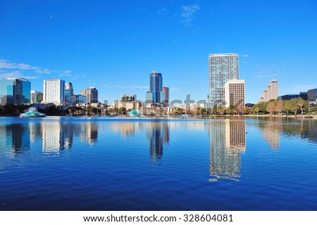 Orlando Lake Eola in the morning with urban skyscrapers and clear blue sky.