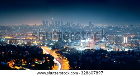 Los Angeles at night with urban buildings and highway