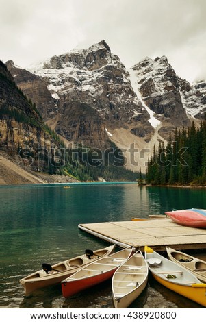 Moraine Lake with boat and snow mountain