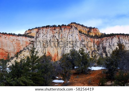 Zion National Park with landmark in the morning with red rocks, road and snow in winter, Utah.