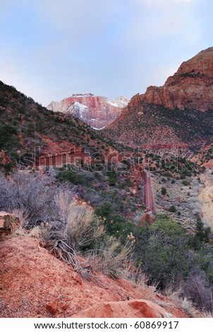 Zion National Park in the morning with red rocks, road and snow in winter, Utah.