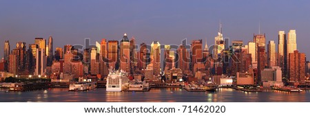 Urban city panorama. New York City Manhattan skyline panorama at sunset with Times Square and skyscrapers with reflection over Hudson river.