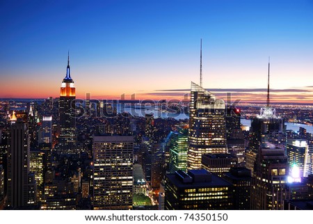 New York City Manhattan skyline aerial view with Empire State Building and Times Square at sunset.