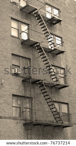 Stairway outside of old building in New York City Manhattan apartment in black and white.