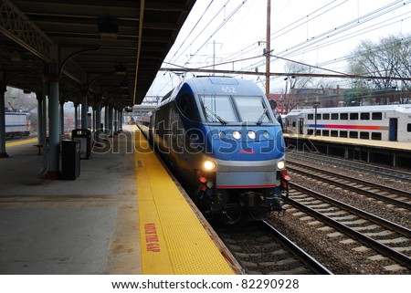 TRENTON, NEW JERSEY - APRIL 3: Amtrak train is arriving at platform on April 3, 2011 in Trenton, New Jersey. Amtrak is owned by US federal government providing intercity passenger train service in US.