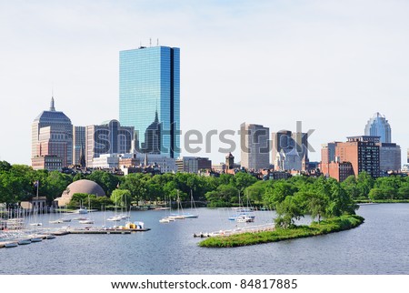 Boston back bay with sailing boat and urban building city skyline in the morning.