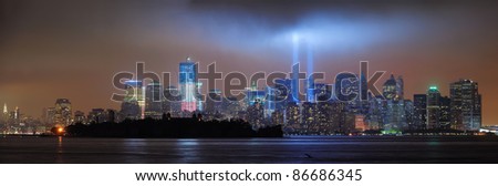 NEW YORK CITY, NY - SEP 11: City night view with light beam on September 11, 2011 in Manhattan, New York City. Light beams are lit at the site in memory of World Trade Center.
