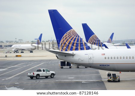 NEWARK, NJ - OCT 5: United Airlines Logo on airplane tail wing at airport on October 5, 2011 in Newark, New Jersey. United Airlines merged with Continental in 2010 as now the world\'s largest airline.