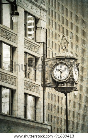 Chicago downtown street view with old fashion clock and skyscraper building in black and white.