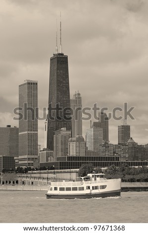 Chicago city urban skyline black and white with skyscrapers over Lake Michigan with cloudy sky.