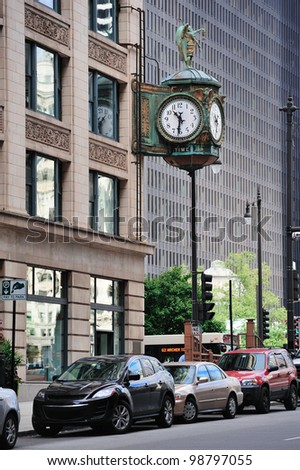 Chicago downtown street view with old fashion clock and skyscraper building.