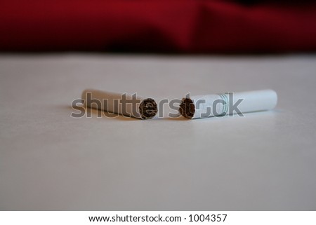 A broken cigarette representing breaking the habit of smoking.  Maybe even for a New Year\'s Resoultion.