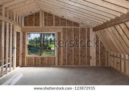 Room addition construction with pitched ceiling and garden view window