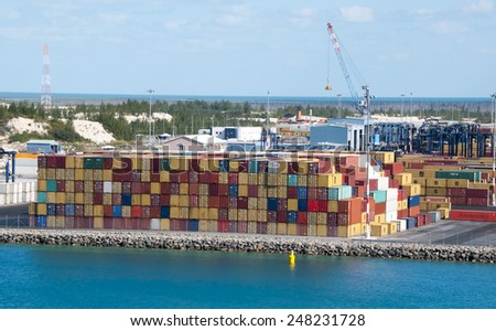 Port of Freeport Bahamas multi colored Container shipyard with deep blue ocean water
