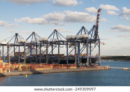 Port of Freeport Bahamas Container shipyard with heavy lifting Cranes and a ship waiting to off load its cargo