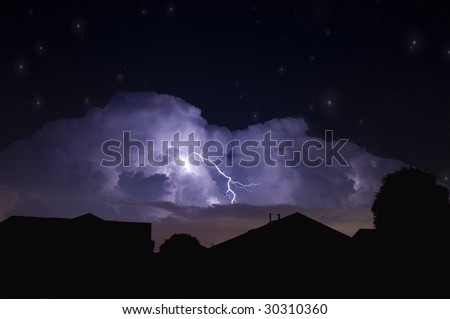 Lightning strike in a dark local neighborhood during a power outage and star field background