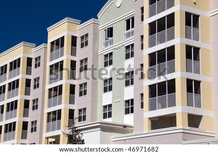 High contrast multi colored high rise condominiums with individual balconys