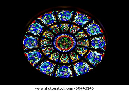 Round stain glass window known as a rose window