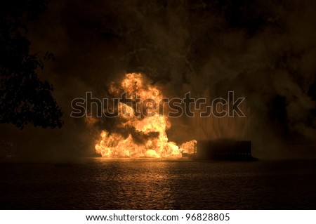 Gas fire explosion on water at night