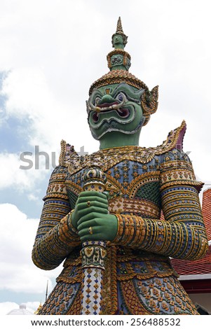 Demon Guardian statues decorating the Buddhist temple Wat Arun in Bangkok, Thailand